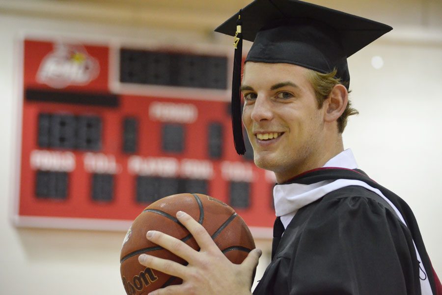 Graduate scores on the court and in class